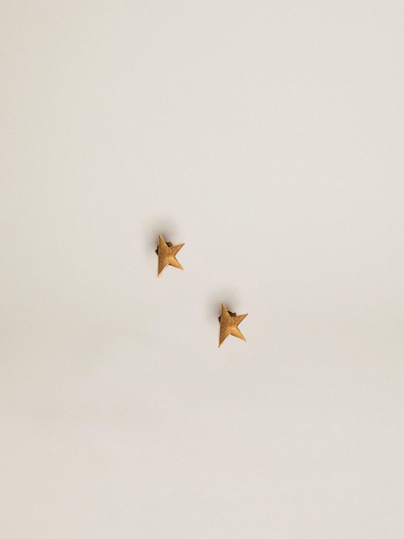 Stud earrings in old gold color